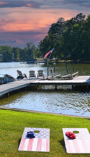 Lake Sinclair lake house with boat dock and wooded shoreline